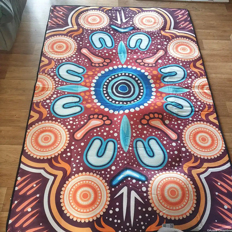 Colorful patterned towel on a wooden floor