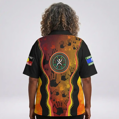 Person wearing a colorful shirt with patterns and symbols on the back, against a white background. Australia Naidoc Week 2024 Polo Shirt - Keep The Fire Burning! Blak, Loud and Proud 3