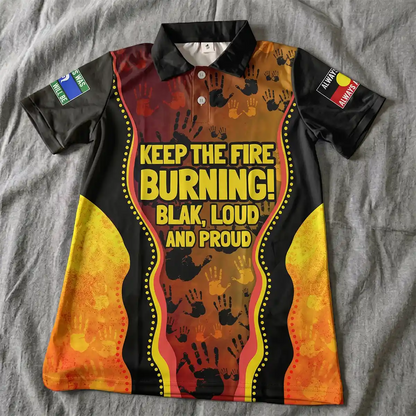 Colorful shirt with text and design on a gray surface. Australia Naidoc Week 2024 Polo Shirt - Keep The Fire Burning! Blak, Loud and Proud 5