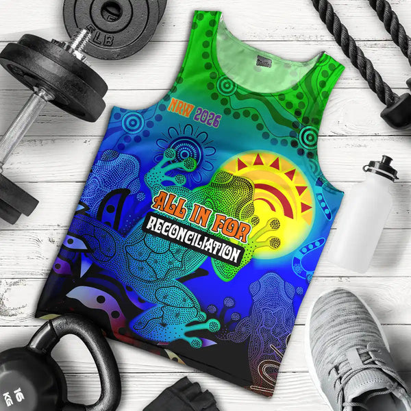 Colorful tank top with 'All In For Reconciliation' design on a wooden surface with fitness equipment. NRW 2026 Men's Tank Top & Singlet - All In For Reconciliation Aboriginal Frogs 1