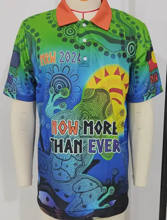 Colorful shirt with abstract designs and text on a mannequin against a white background
