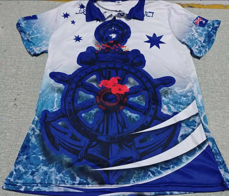 White shirt with blue ship's wheel design on a textured surface