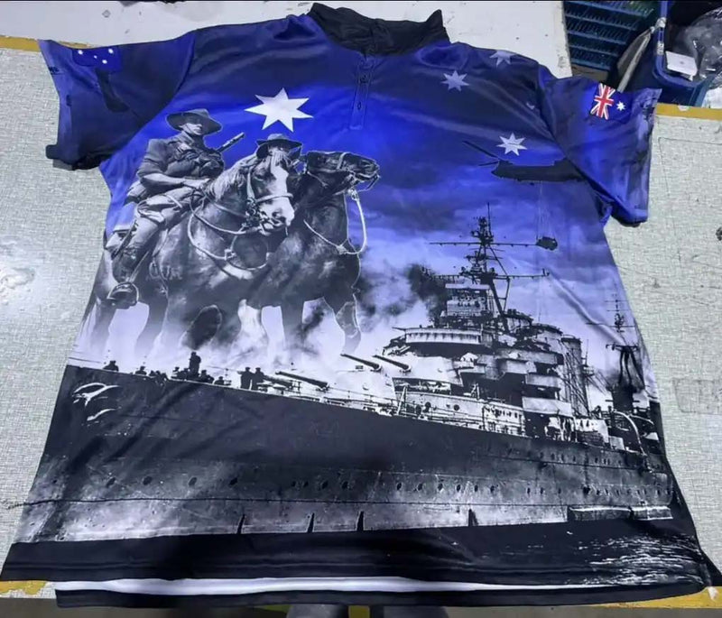 Shirt with military-themed design featuring a horse, soldier, and ship on a blue background.