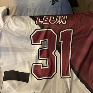 Jersey with 'COLIN' and number '31' on a white and maroon background