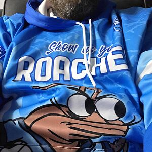 Blue hoodie with cartoon character and text on a person wearing it
