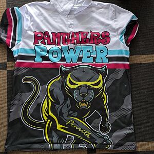 Jersey with 'Panthers Power' text and panther graphic on a checkered floor background