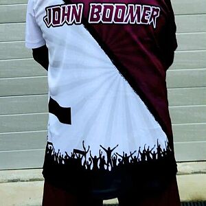 Person wearing a maroon and white shirt with 'John Boomer' printed on it.