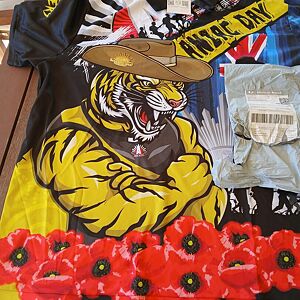 Clothing items with a tiger design and text on a colorful background