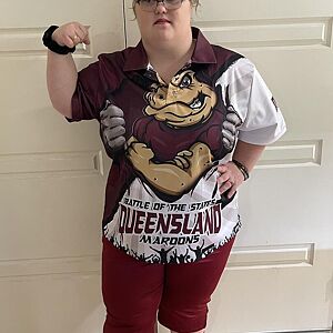 Person wearing a Queensland rugby league jersey with a logo on a white background