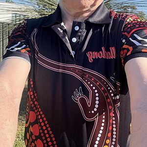 Person wearing a black shirt with red and white patterns and 'probull' branding.