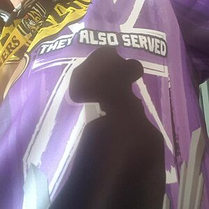 Silhouette of a person against a colorful background with text